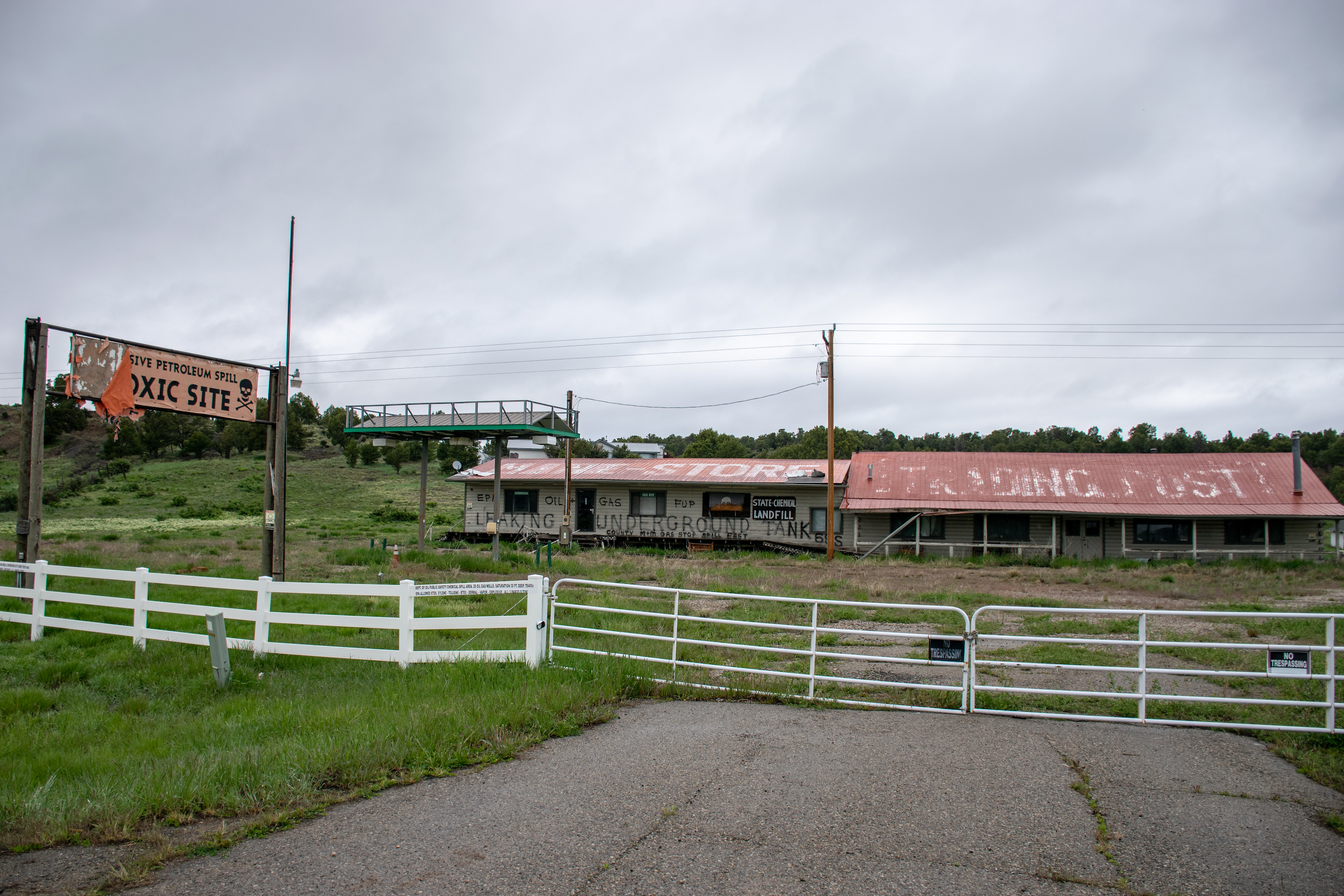 An old trading post with hazardous waste signs all over it