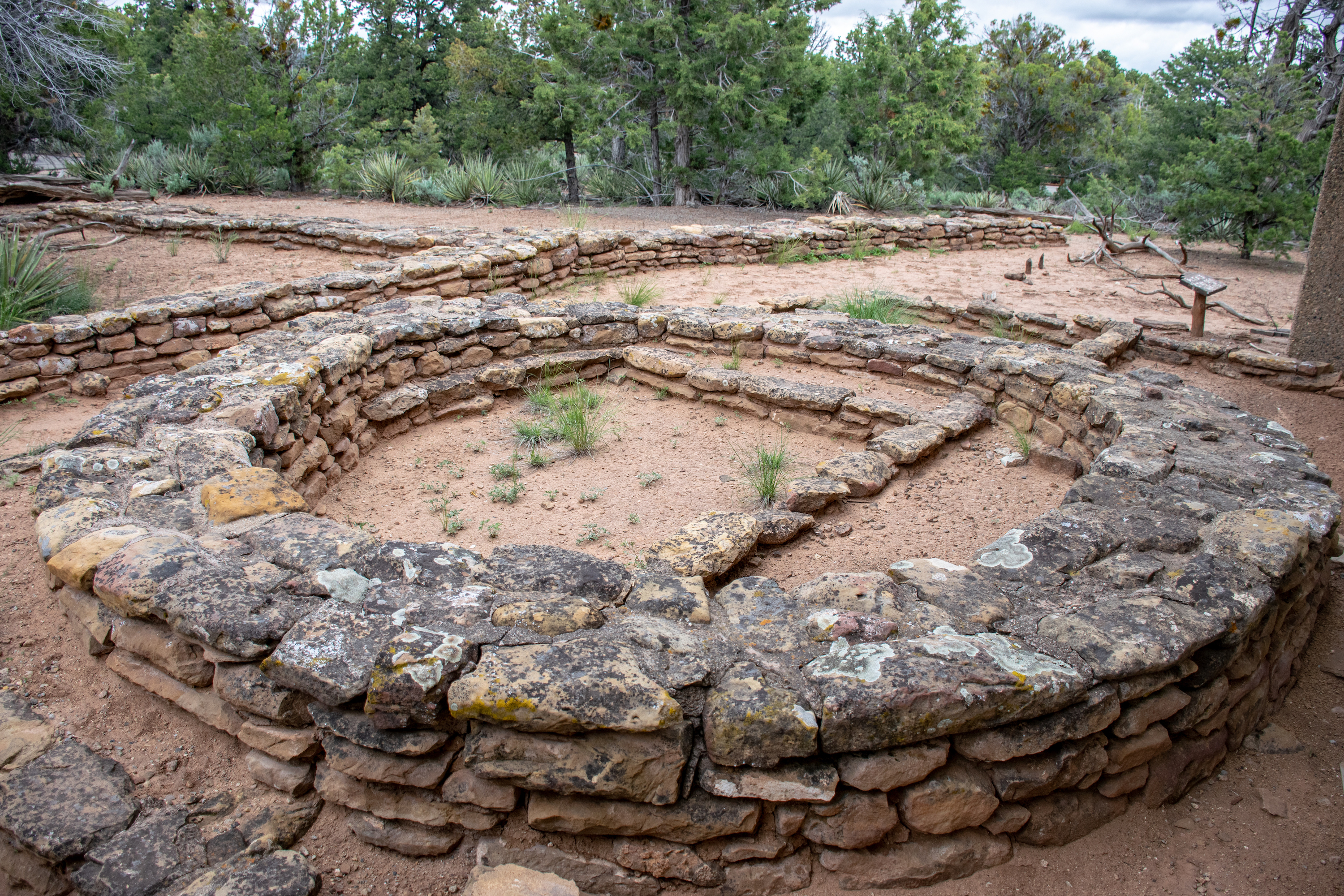 Photo comparing three different generations of architecture left behind by pueblo Indians 